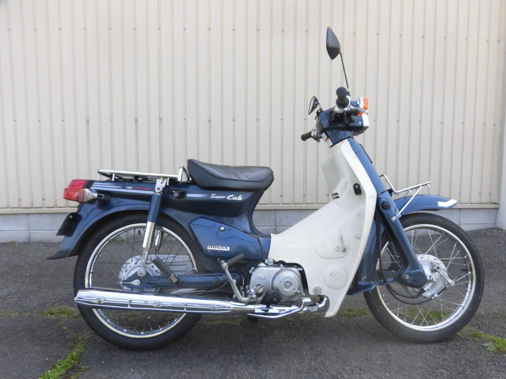 中古 HONDA スーパーカブ90 カスタム C90 CM5 角目、セル付き JUNインターナショナル製ノーマルヘッド用ハイカムシャフト装着、  機種コードC90CM5 2005年製 | 新車大型二輪 中型二輪だけでなく、中古原付からスクーターまで販売。三重県名張市Empty